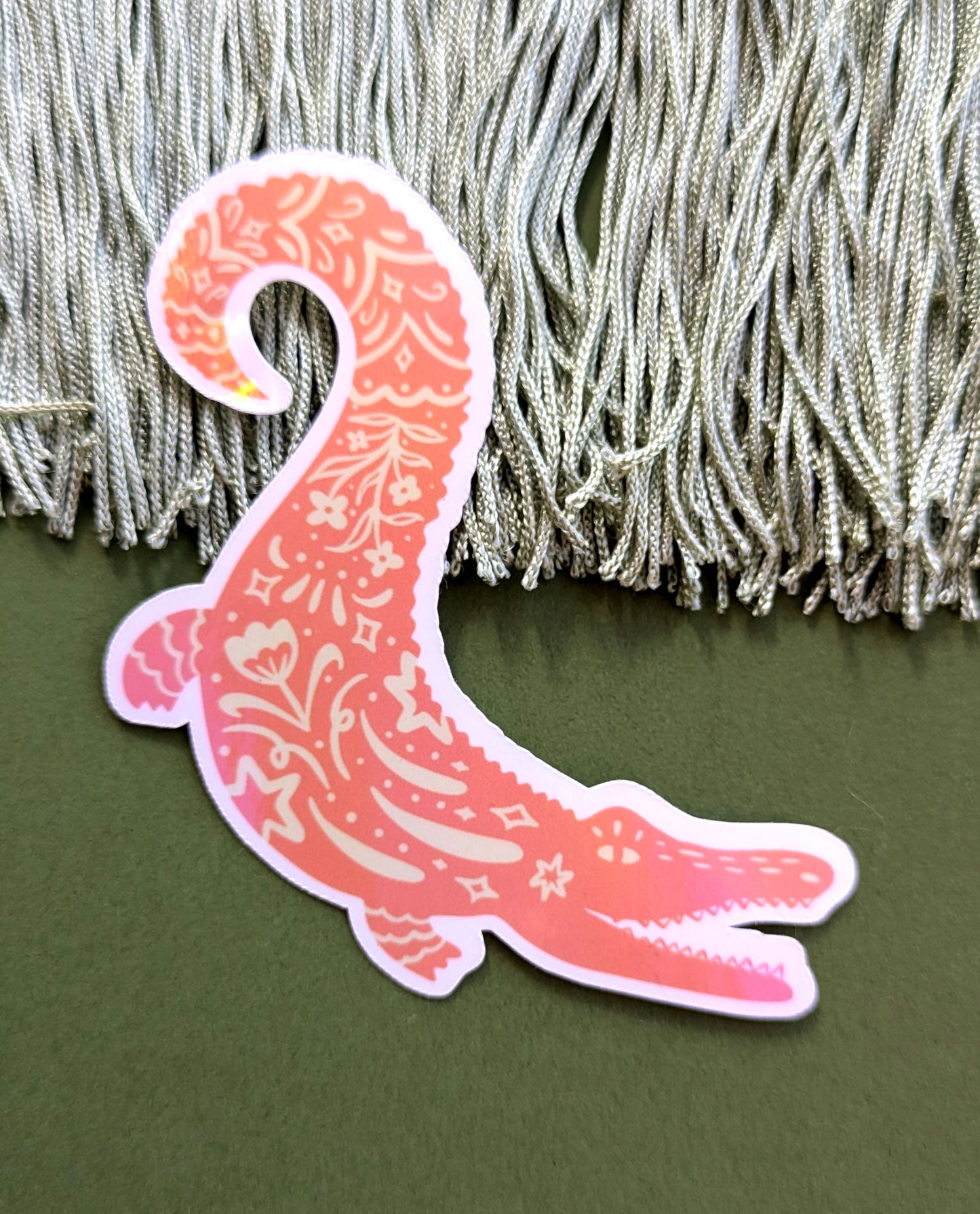 Sticker of an alligator with a holographic lamination